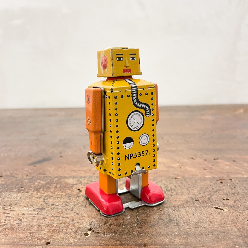Little yellow metal walking robot