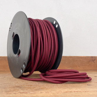 Round burgundy woven electric cable