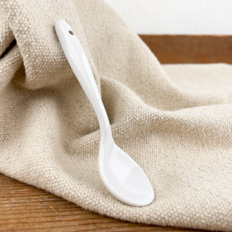 Small white porcelain spoon