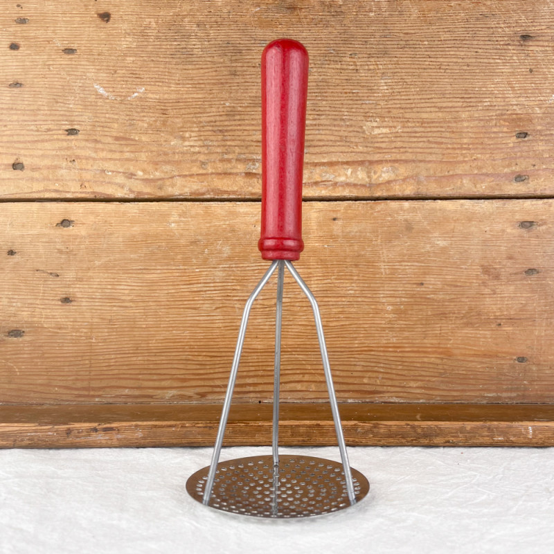 Red iron and wood potato masher