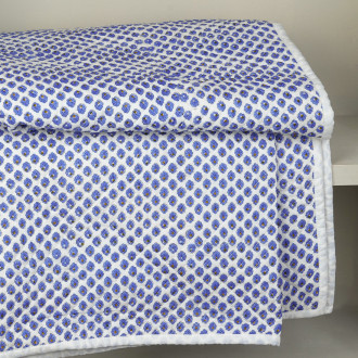 Blue daisy quilted bedspread