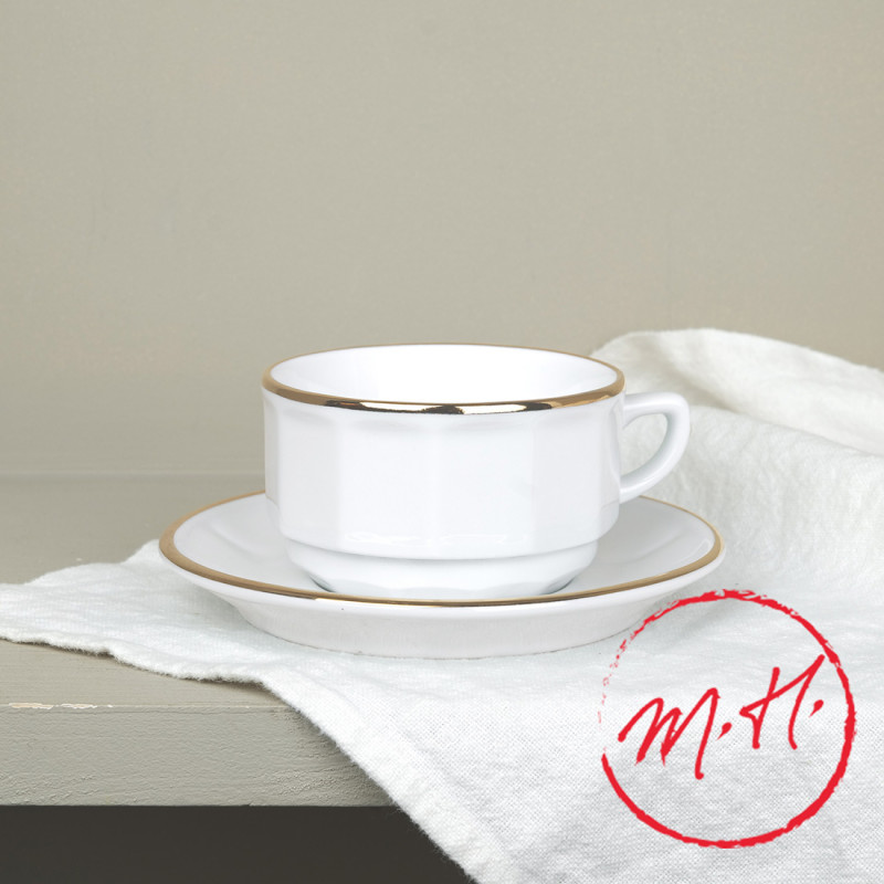 White cup and saucer with gold thread
