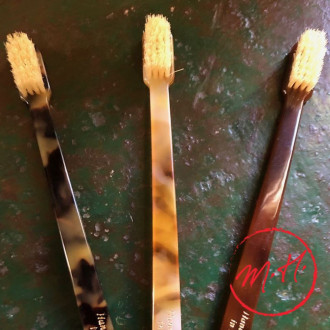 Bristle/shaving toothbrush