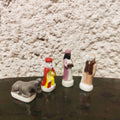 4 fèves santons en porcelaine