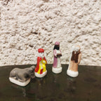 4 fèves santons en porcelaine