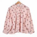 Blouse rose à fleurs