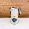 Cafetière italienne avec fermeture par rotation de la poignée