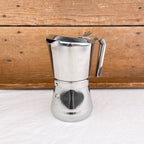 Cafetière italienne avec fermeture par rotation de la poignée