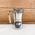 Cafetière italienne avec fermeture par rotation de la poignée
