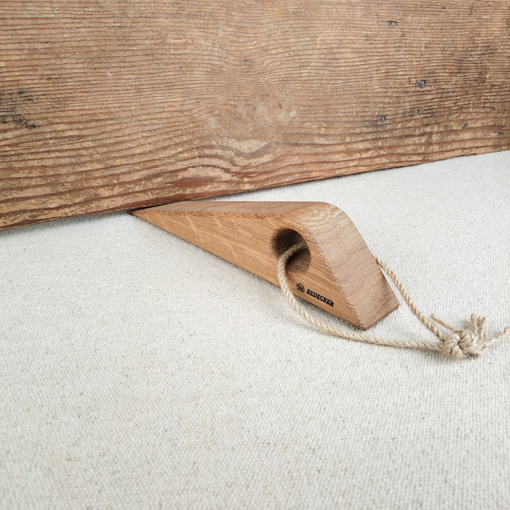 Cale-porte en bois avec corde
