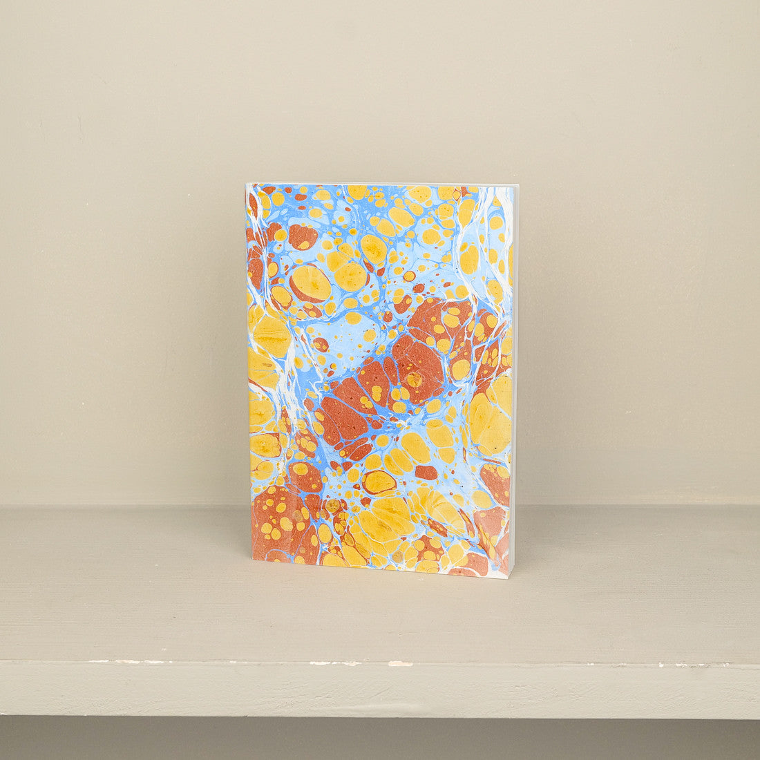 Carnet A5 en papier marbré orange