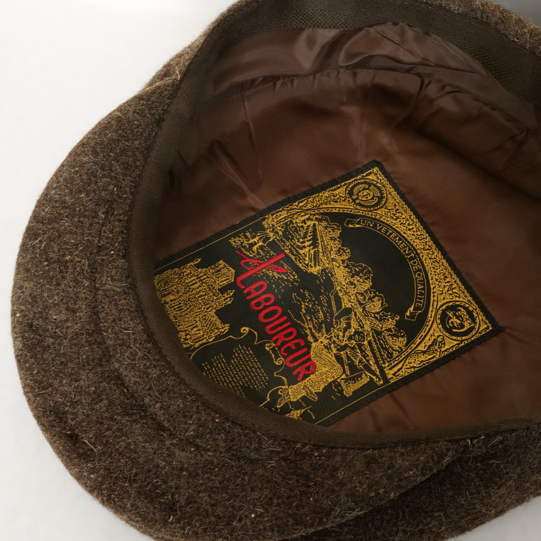 Brown wool flat cap detail, natural fibre texture