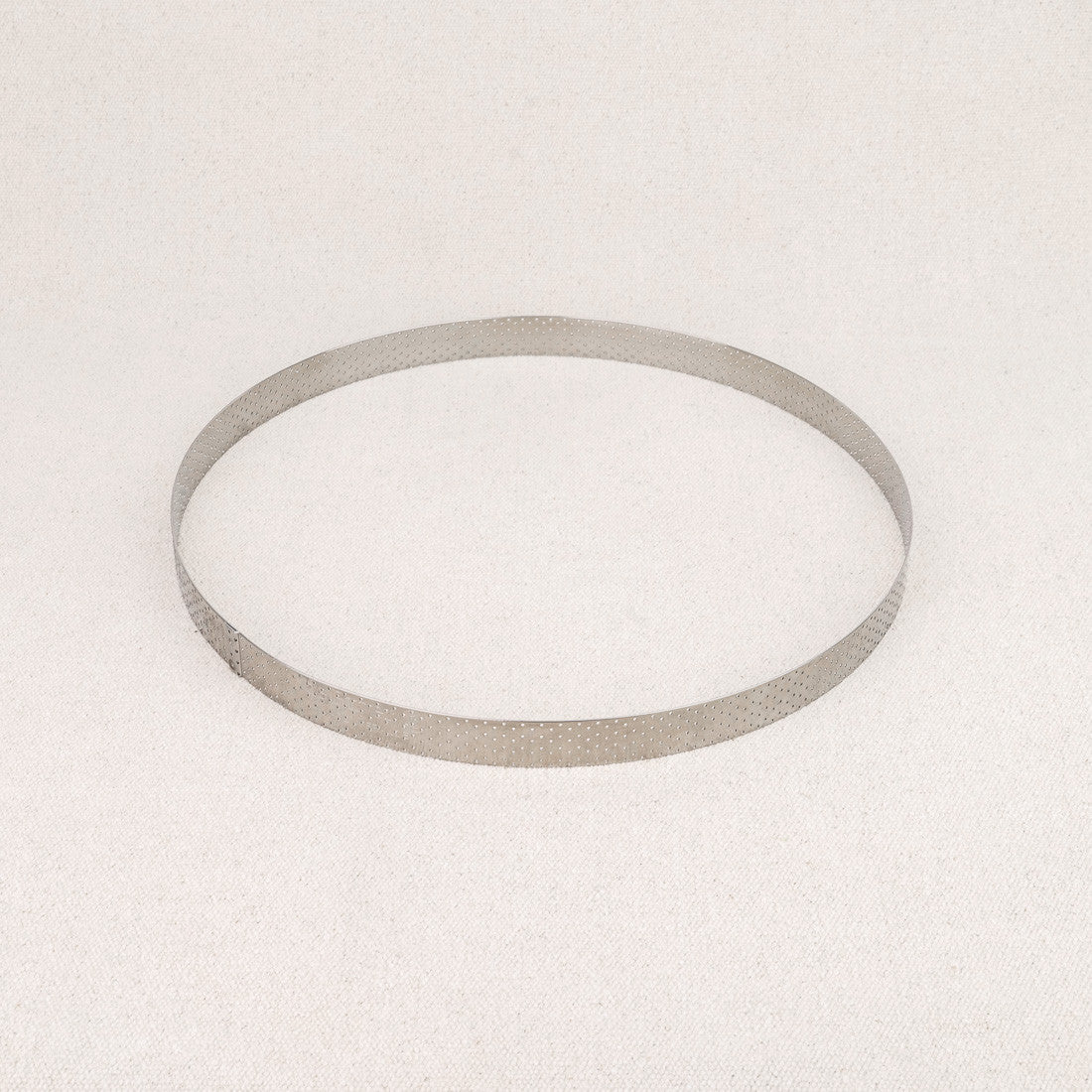 Cercle à tarte perforé en inox De Buyer 24,5 cm