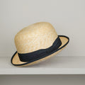 Chapeau melon en paille tressée