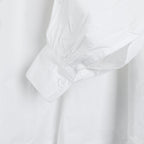 Buttoned cuff detail on the white Picasso shirt by Coline Diffusion, gathered sleeve