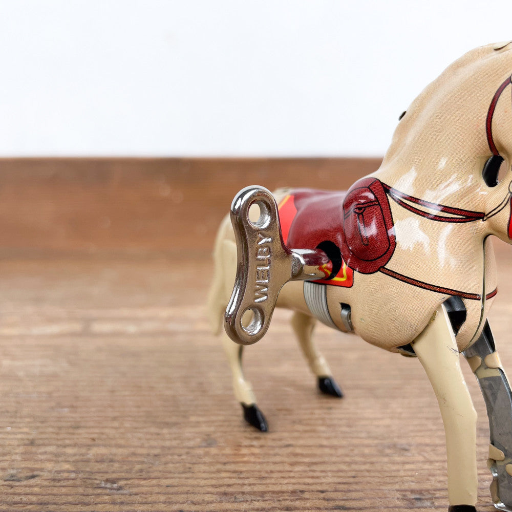 Cheval mécanique à clé beige