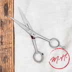 Ciseaux de coiffeur avec poucette à vis