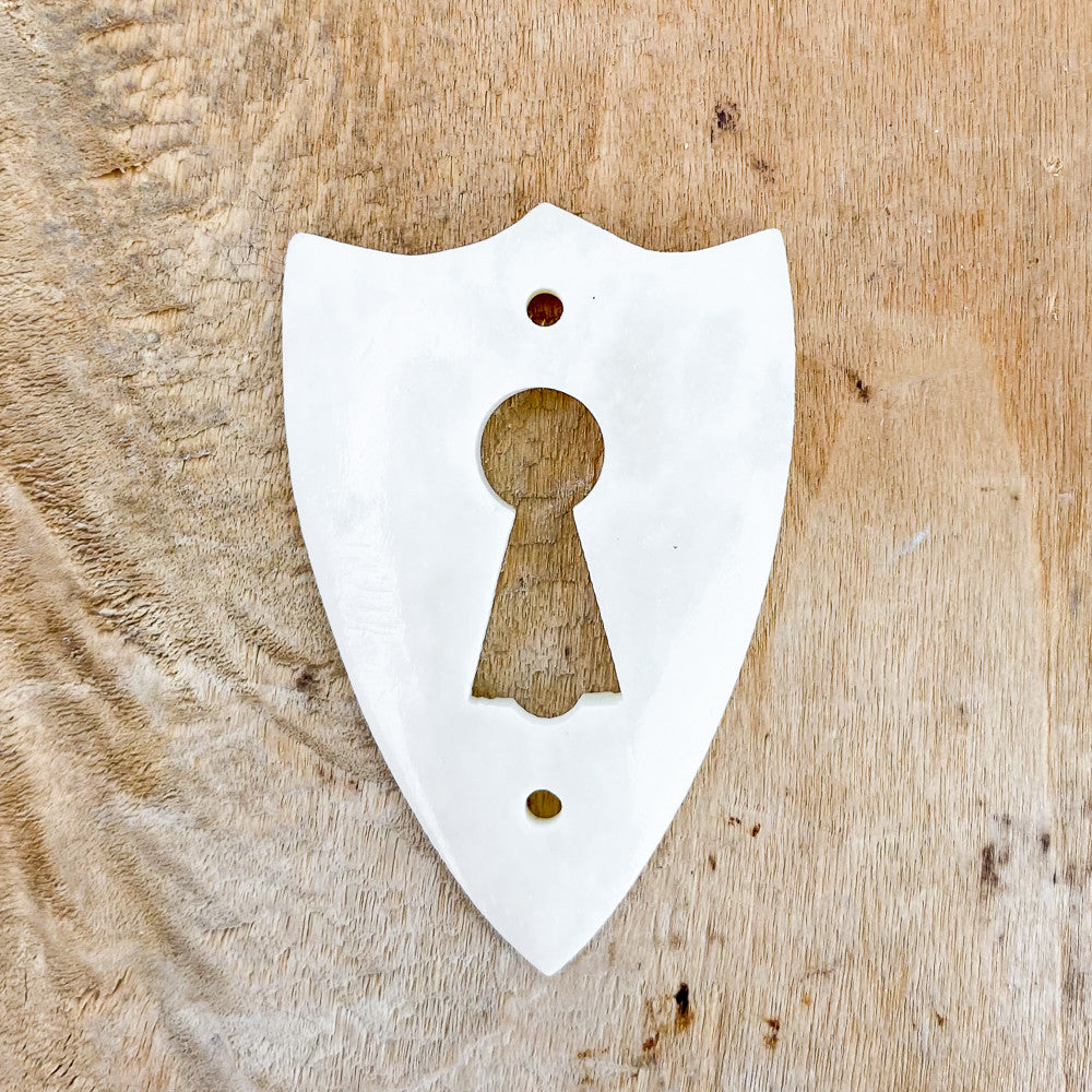 Entrée de clef en os et porcelaine