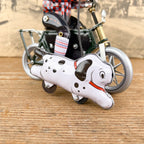 Garçon à bicyclette mécanique avec chien
