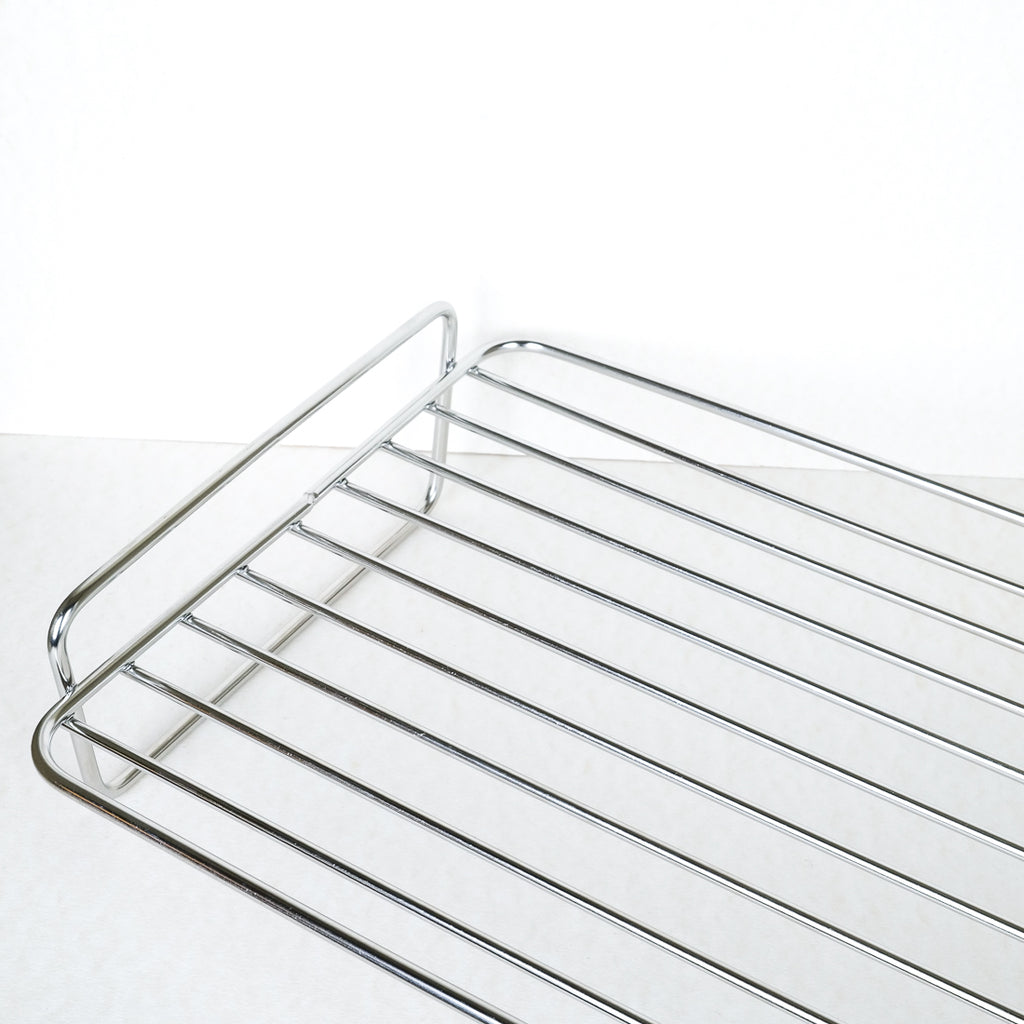 Kitchen Craft stainless steel roasting rack, close-up of wire bars and curved handle detail