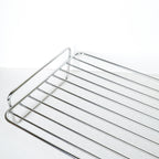 Kitchen Craft stainless steel roasting rack, close-up of wire bars and curved handle detail