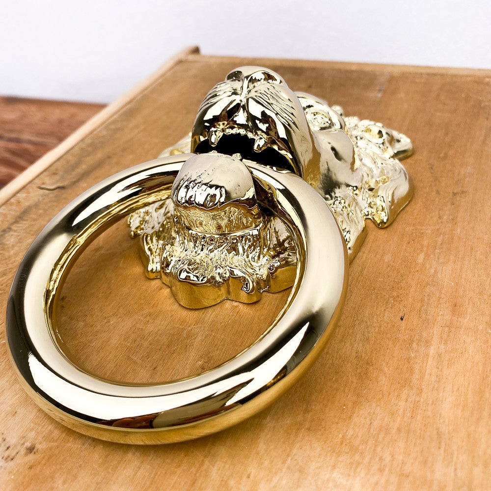 Heurtoir de porte tête de lion en laiton poli