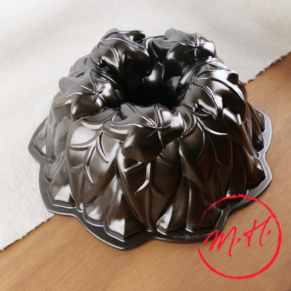 Nordic Ware cast aluminium bundt pan, top view showing central tube and leaf pattern