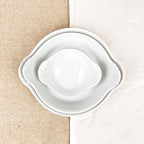 Plat rond à oreilles en porcelaine