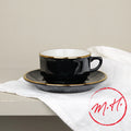 Tasse et soucoupe noire filet or