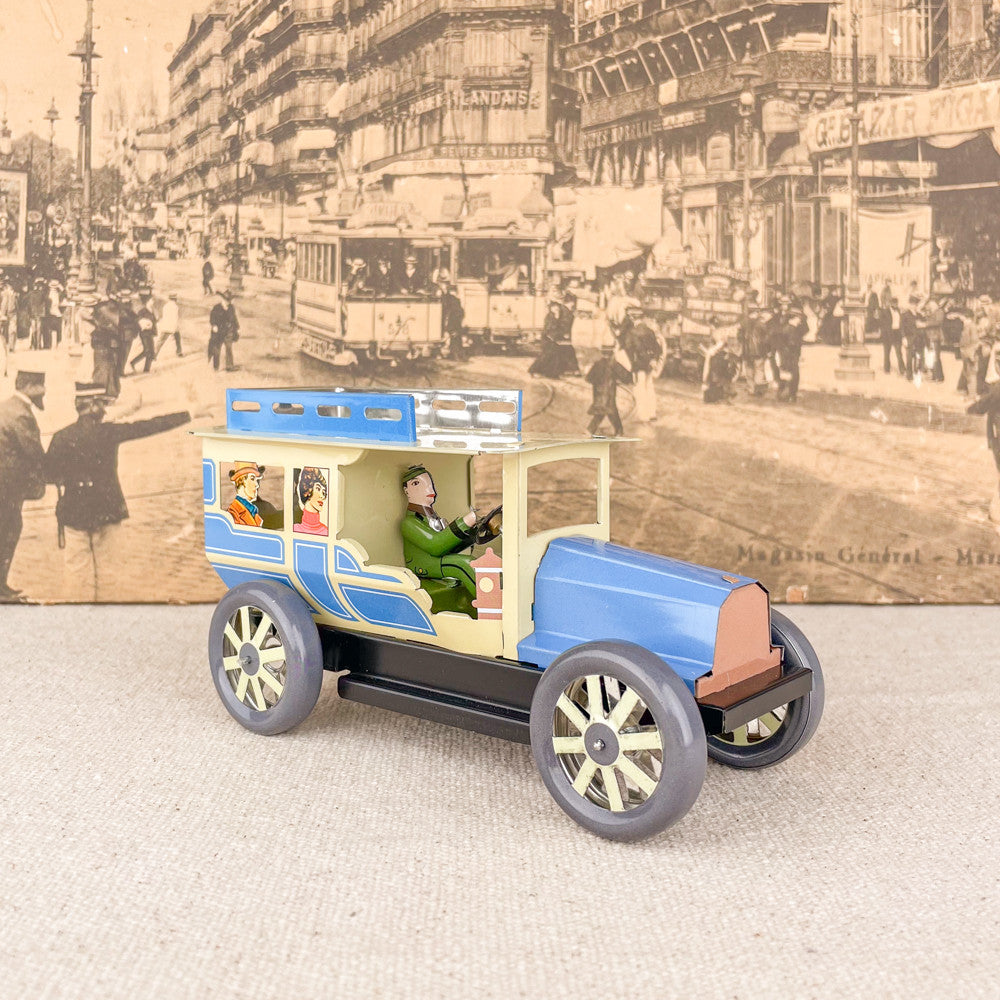Voiture limousine beige et bleue mécanique