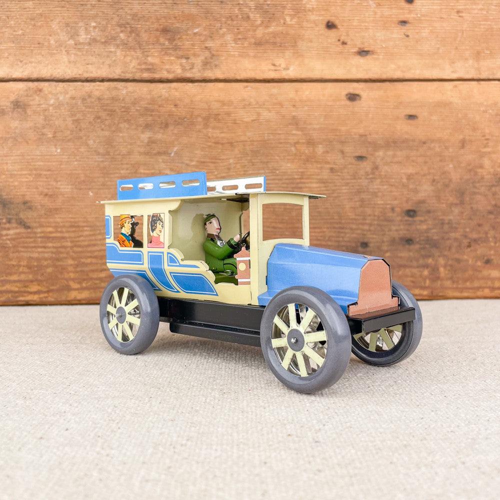 Voiture limousine beige et bleue mécanique